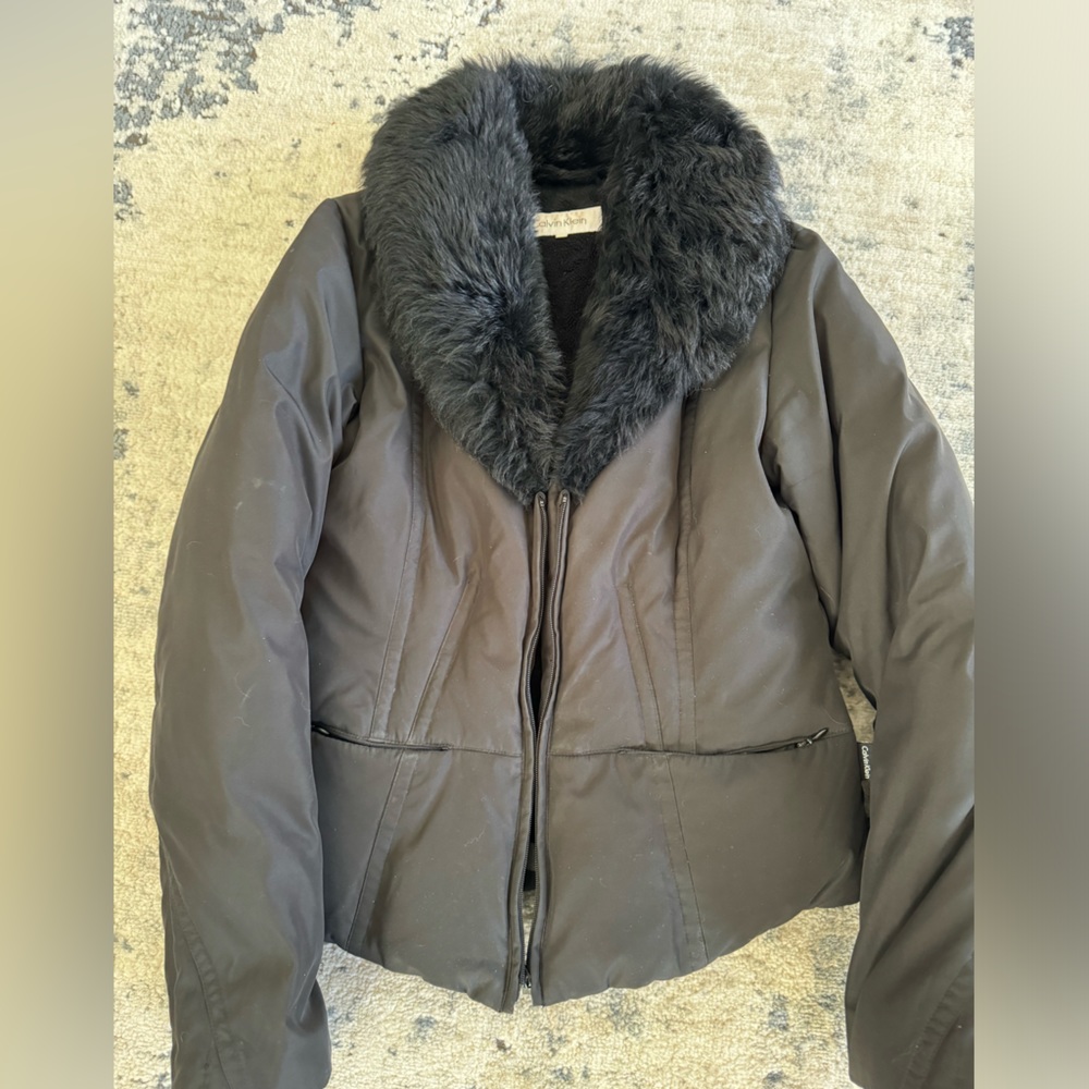 Black Calvin Klein Jacket with sheep fur collar.  Super warm!
